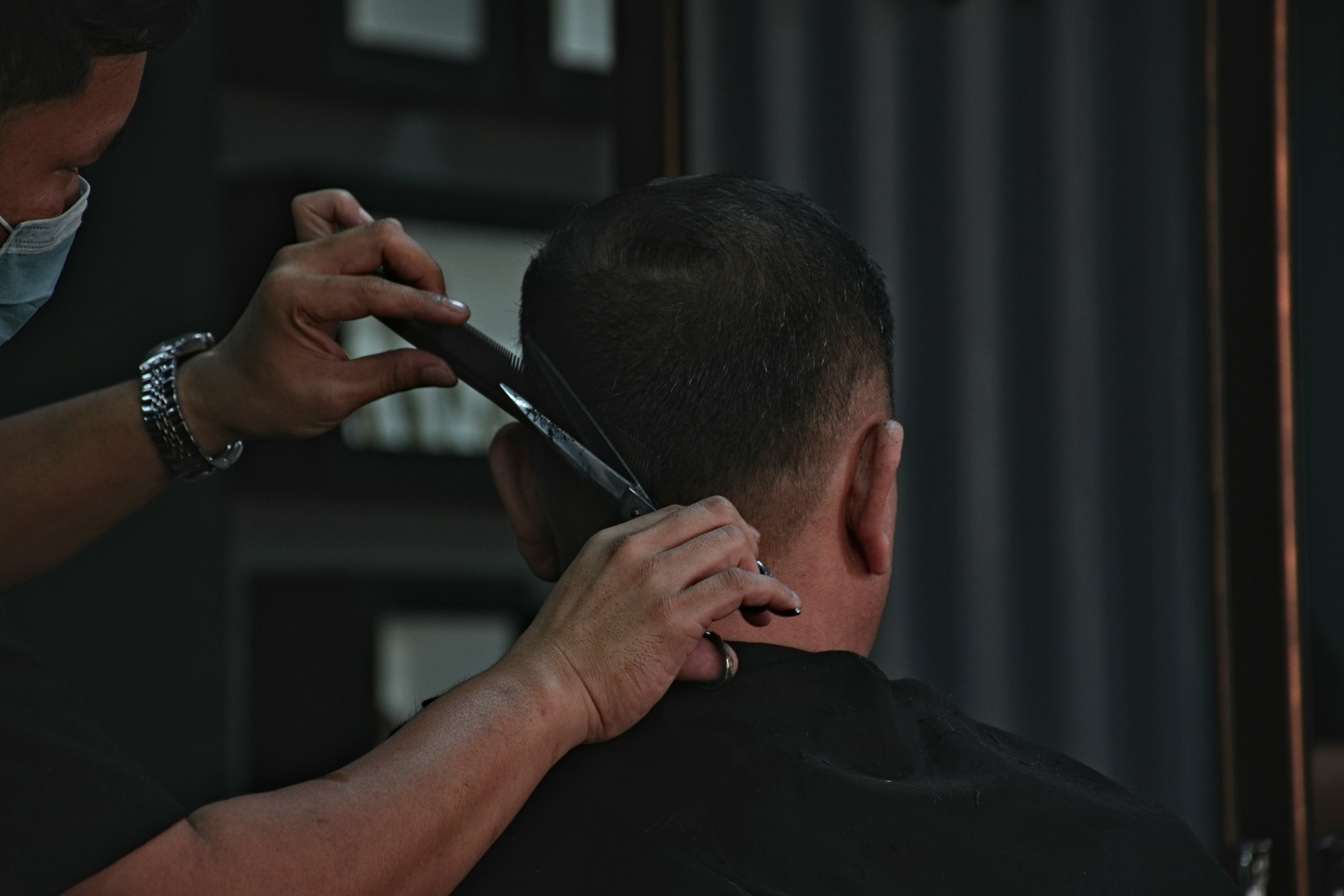 Barber working on a haircut